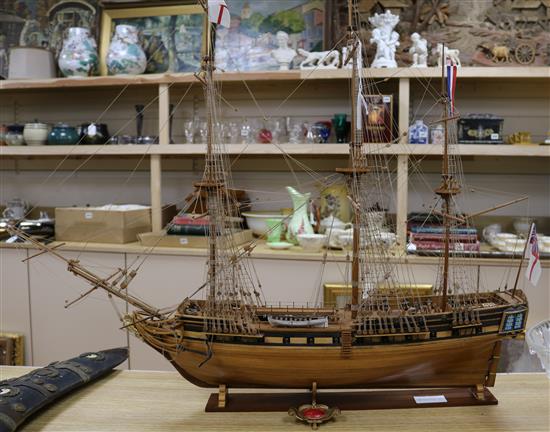 A wooden model of a three masted ship length 81cm